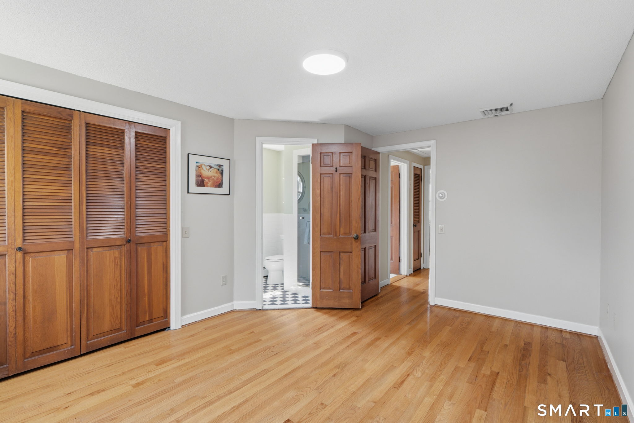 32 Meadowgate Street Wethersfield, CT 06109 - Photo 28 of 40 a view of empty room with wooden floor and fan