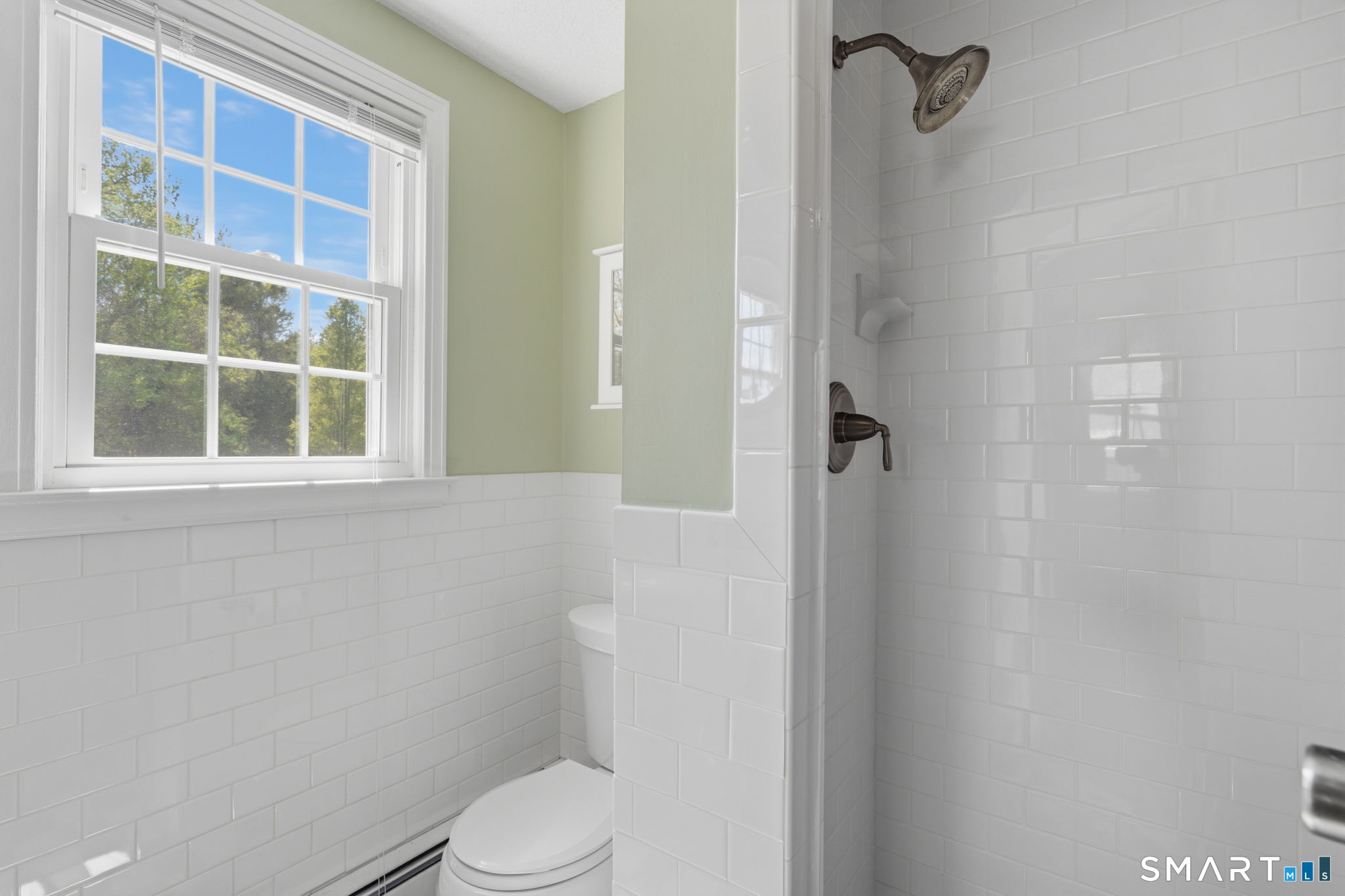32 Meadowgate Street Wethersfield, CT 06109 - Photo 29 of 40 a white toilet sitting next to a bathroom sink