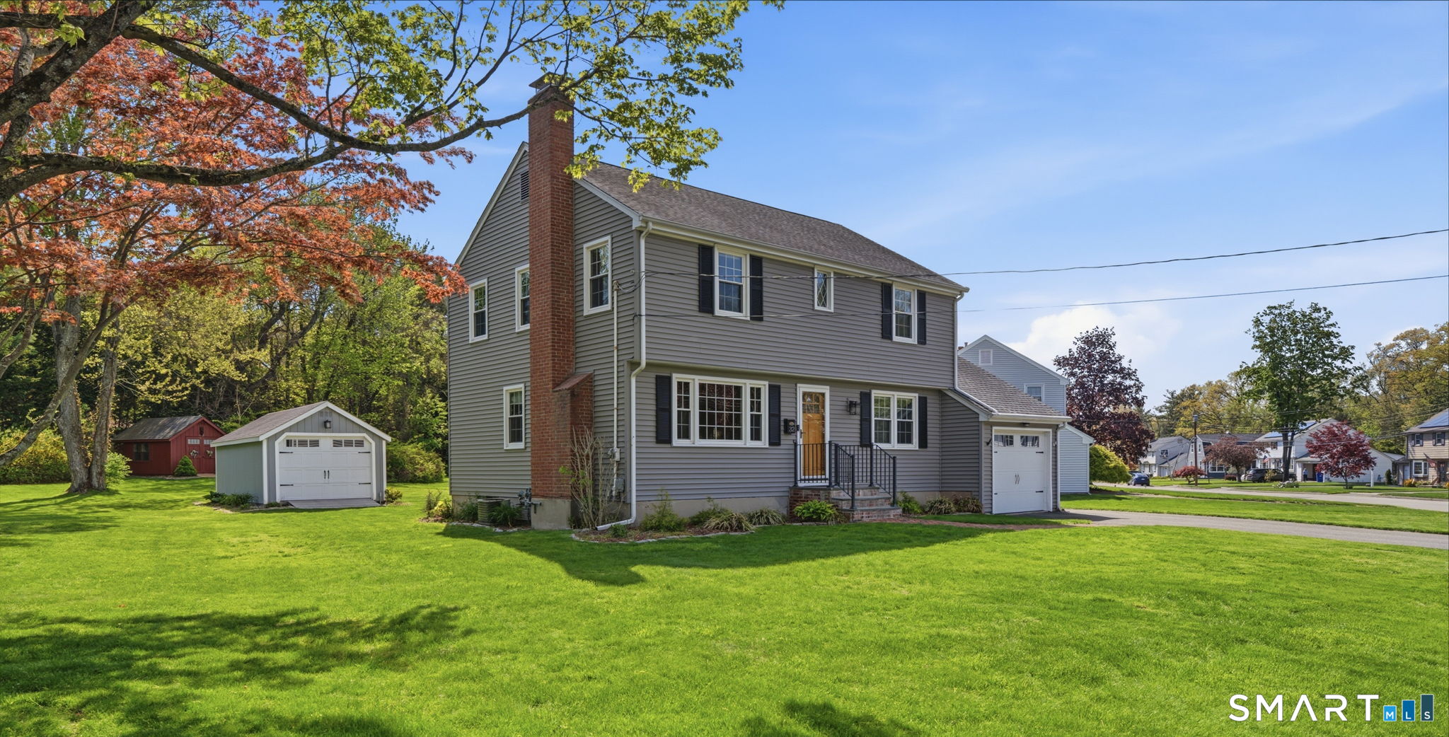 32 Meadowgate Street Wethersfield, CT 06109 - Photo 3 of 40 a front view of house with yard and green space