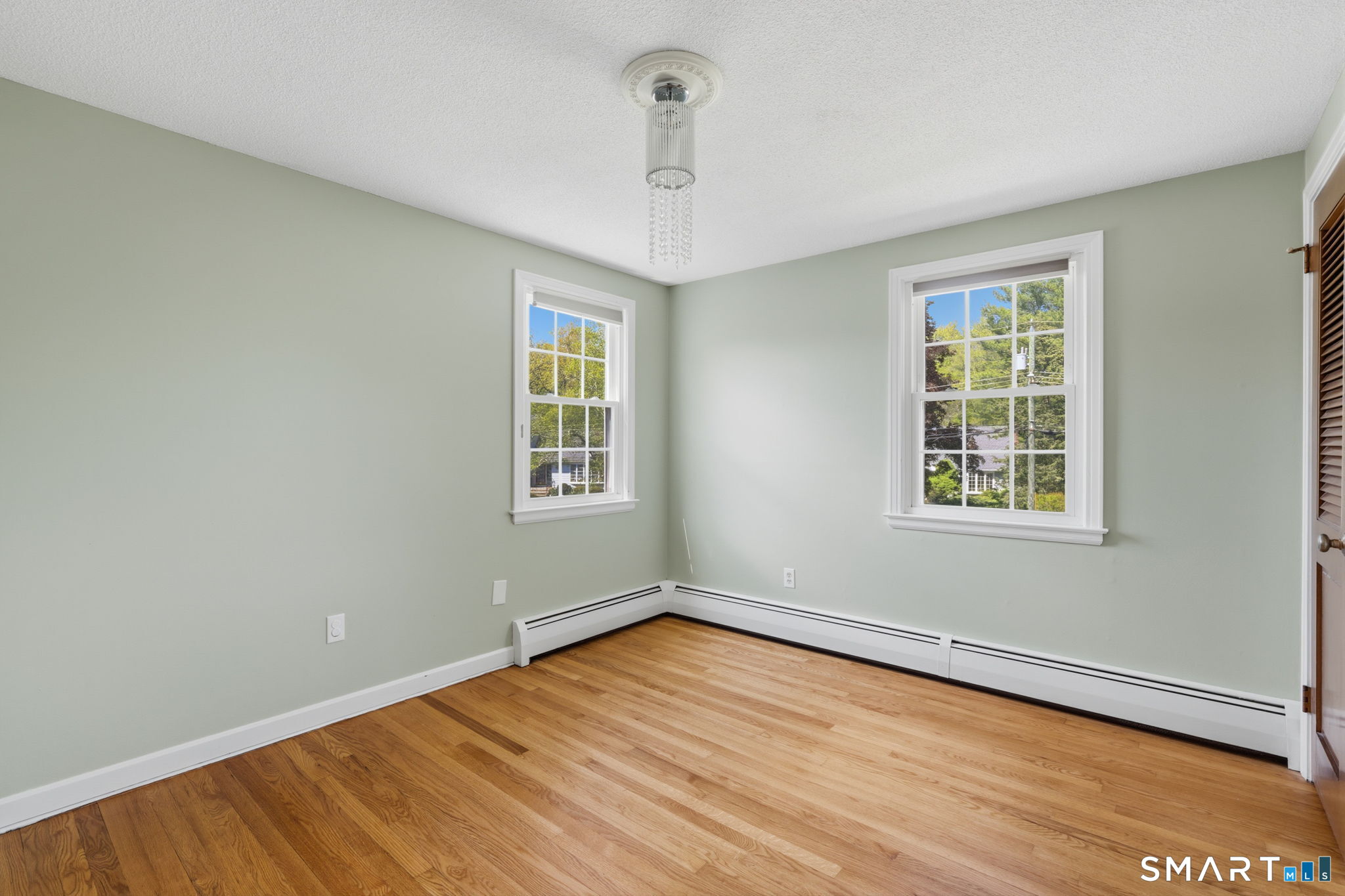 32 Meadowgate Street Wethersfield, CT 06109 - Photo 34 of 40 wooden floor in an empty room with a window