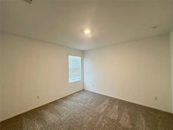 an empty room with a empty space and window