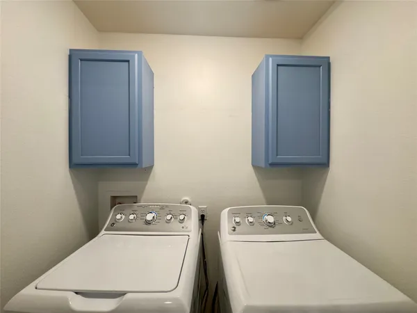 a utility room with dryer and washer