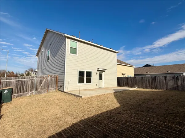 a view of a house with a wooden deck
