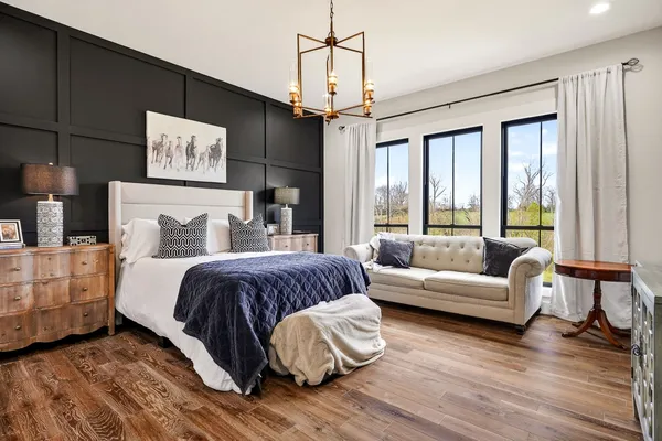 a bathroom with a toilet a sink and a mirror