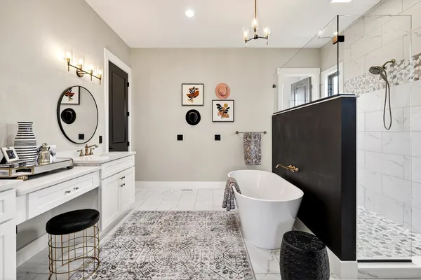 a room with lots of frames and paintings on the wall