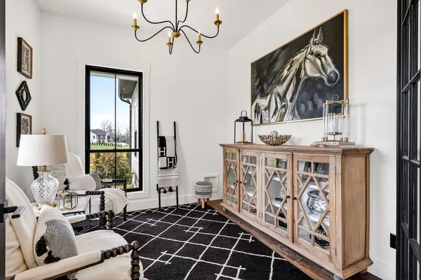a bedroom with furniture window and wooden floor
