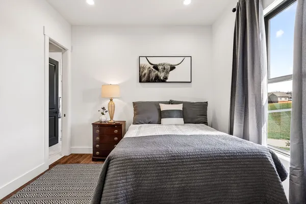 a bathroom with a shower a toilet and sink