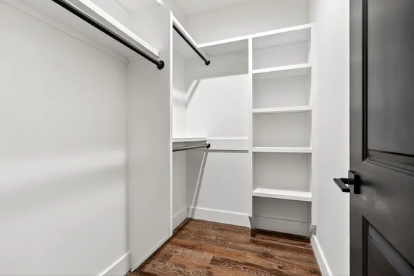 a aerial view of a house with a big yard and potted plants