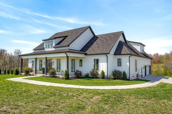 an aerial view of a house with a swimming pool