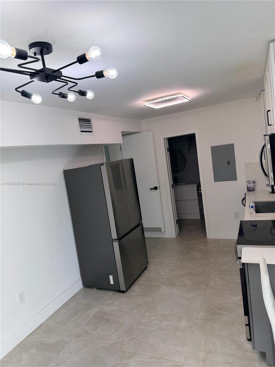 911 79th Terrace, Unit B Miami Beach, FL 33141 - Photo 2 of 9 a view of a storage & utility room