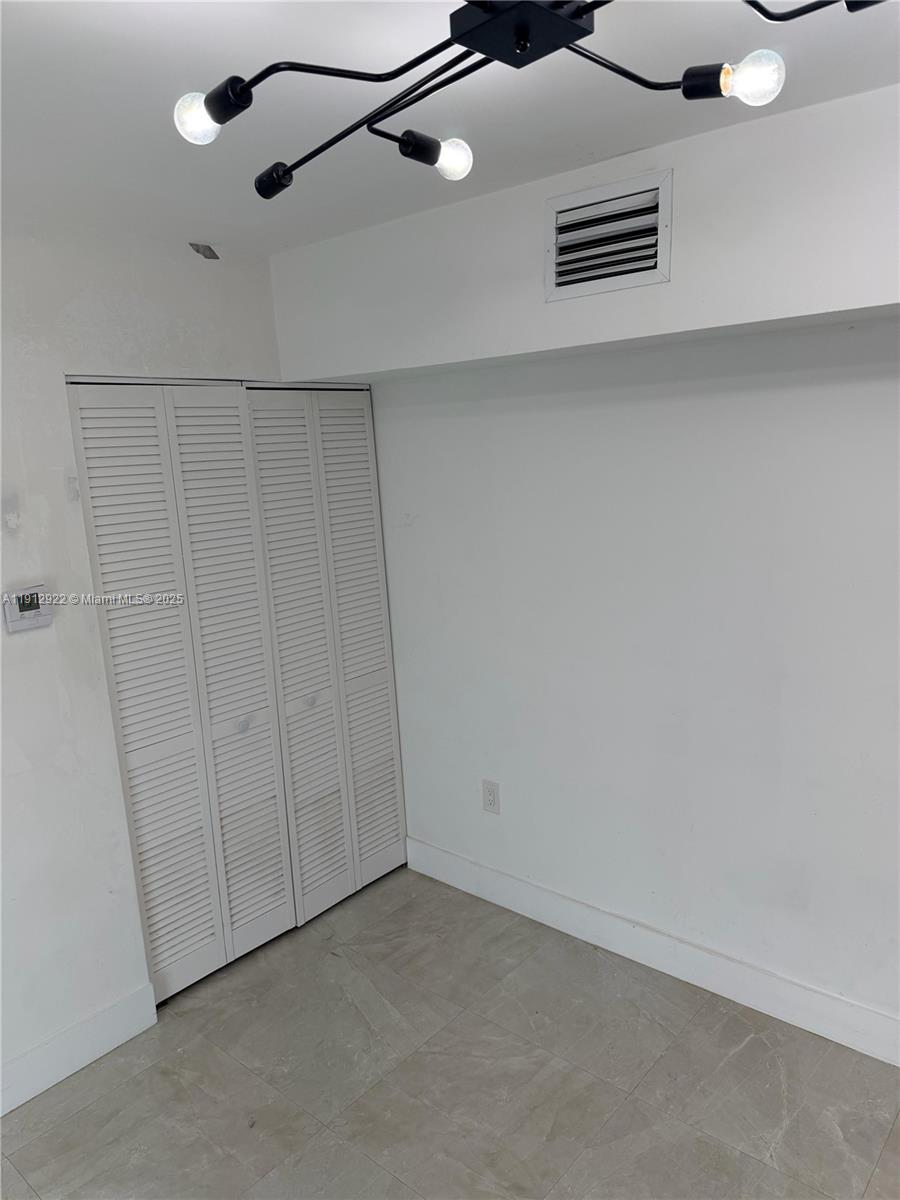 911 79th Terrace, Unit B Miami Beach, FL 33141 - Photo 6 of 9 a view of empty room