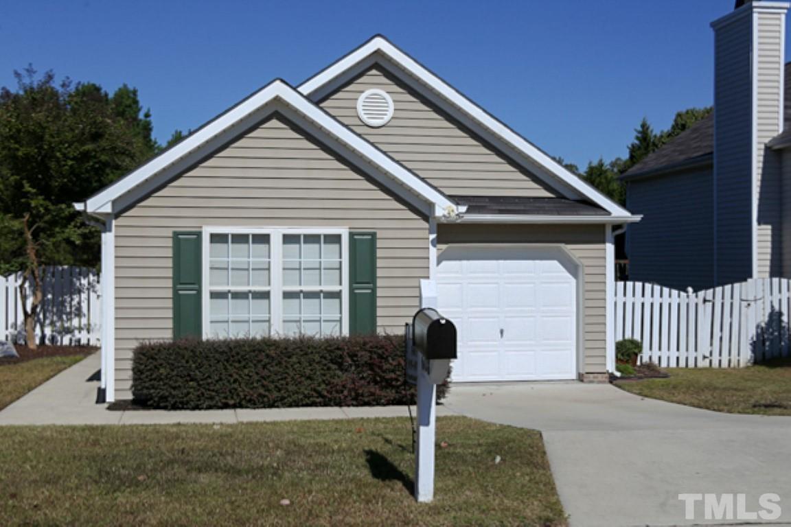 608 Edenberry Drive Durham, NC 27713 - Photo 1 of 14 a front view of a house with garden