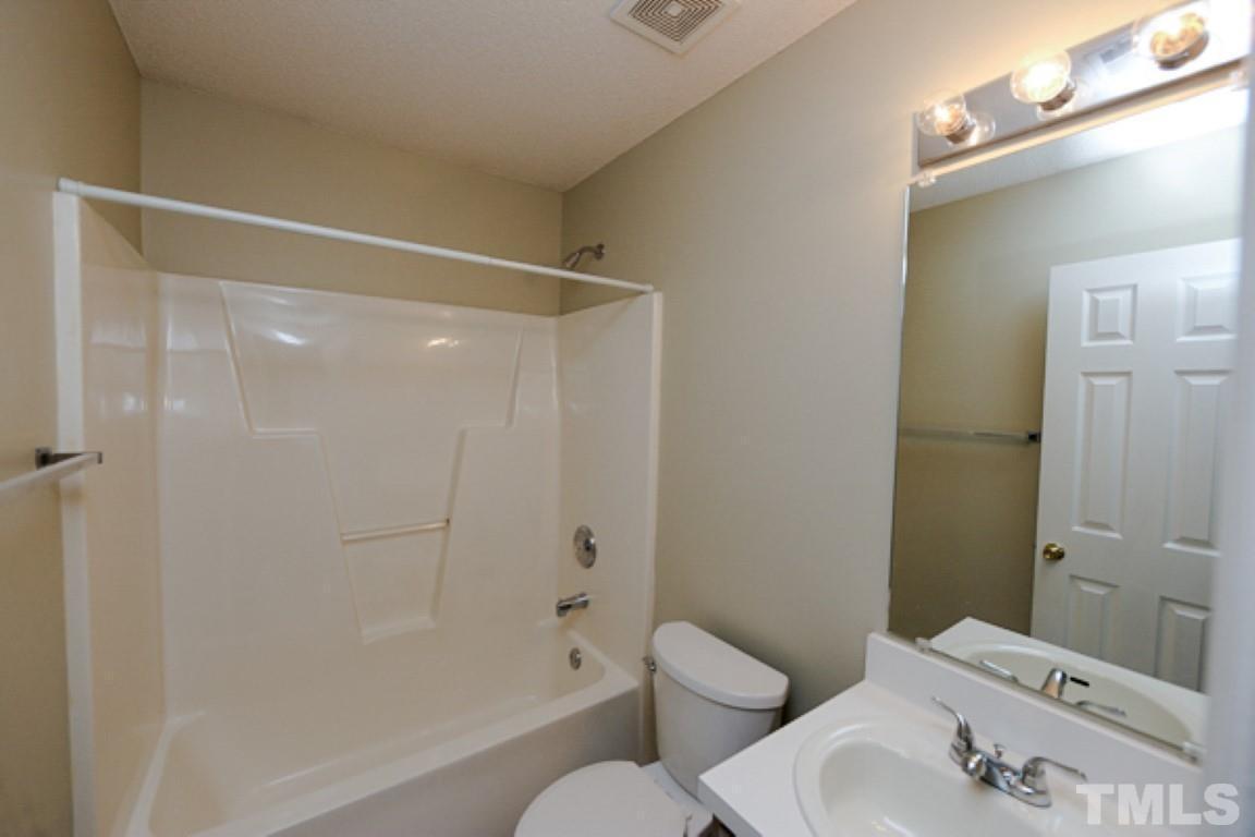 608 Edenberry Drive Durham, NC 27713 - Photo 11 of 14 a bathroom with a sink and a mirror