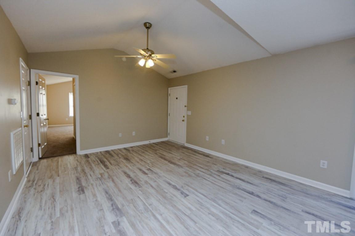 608 Edenberry Drive Durham, NC 27713 - Photo 3 of 14 wooden floor in an empty room with a window