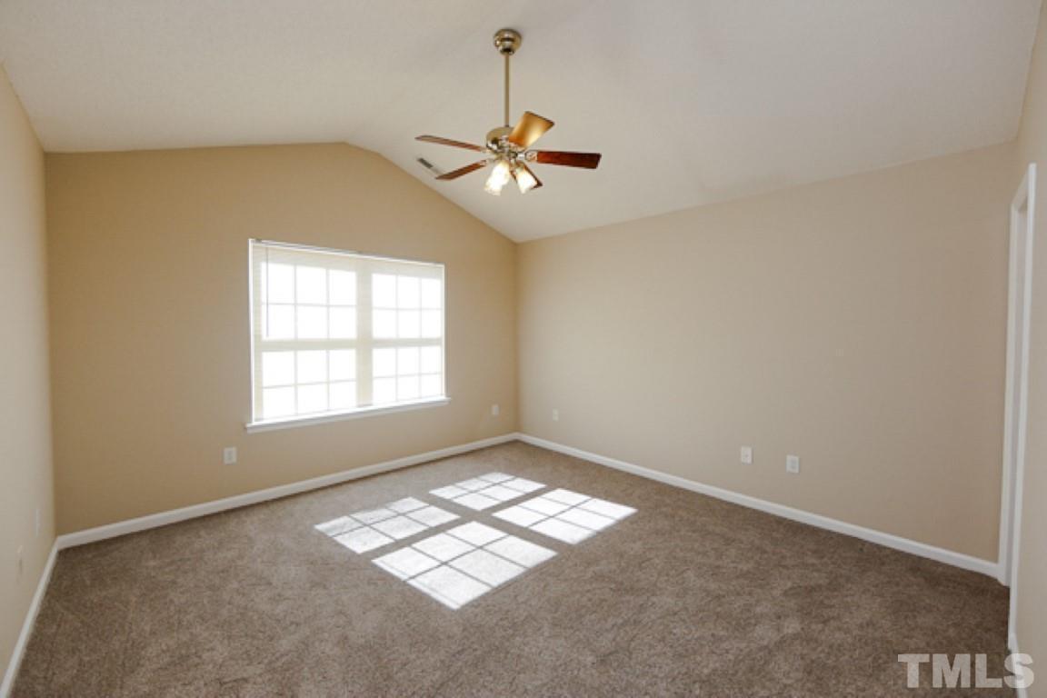 608 Edenberry Drive Durham, NC 27713 - Photo 7 of 14 an empty room with windows and fan