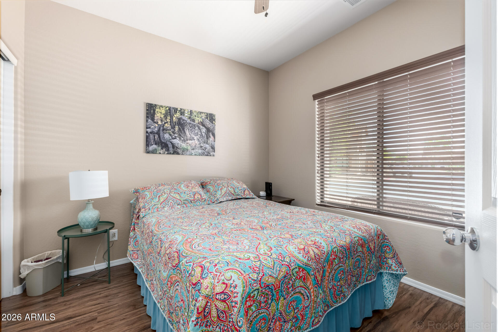 2756 South Powell Road Apache Junction, AZ 85119 - Photo 25 of 37 a bedroom with a bed and a painting on the wall