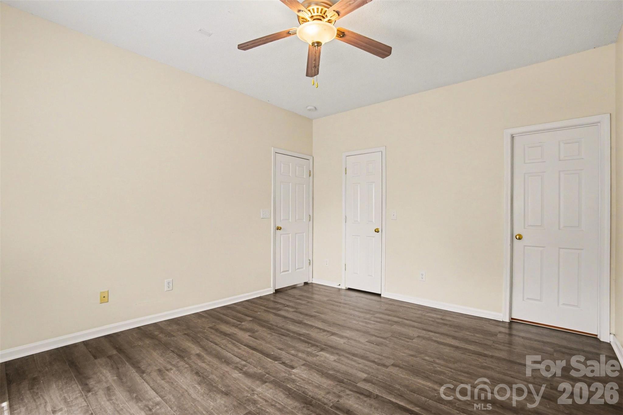 3315 Summerfield Ridge Lane Matthews, NC 28105 - Photo 12 of 27 a view of a room with wooden floor and ceiling fan