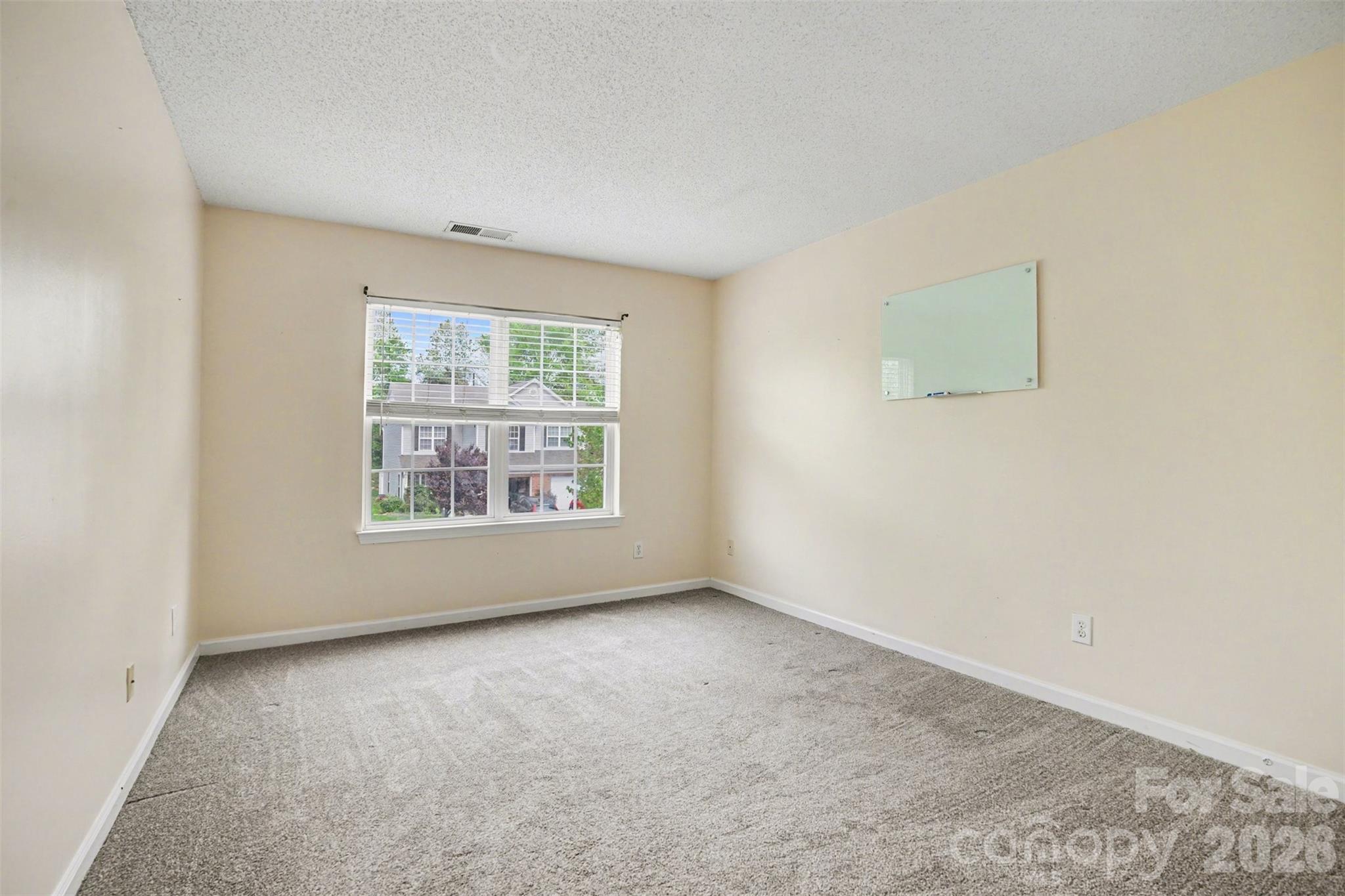 3315 Summerfield Ridge Lane Matthews, NC 28105 - Photo 16 of 27 an empty room with windows
