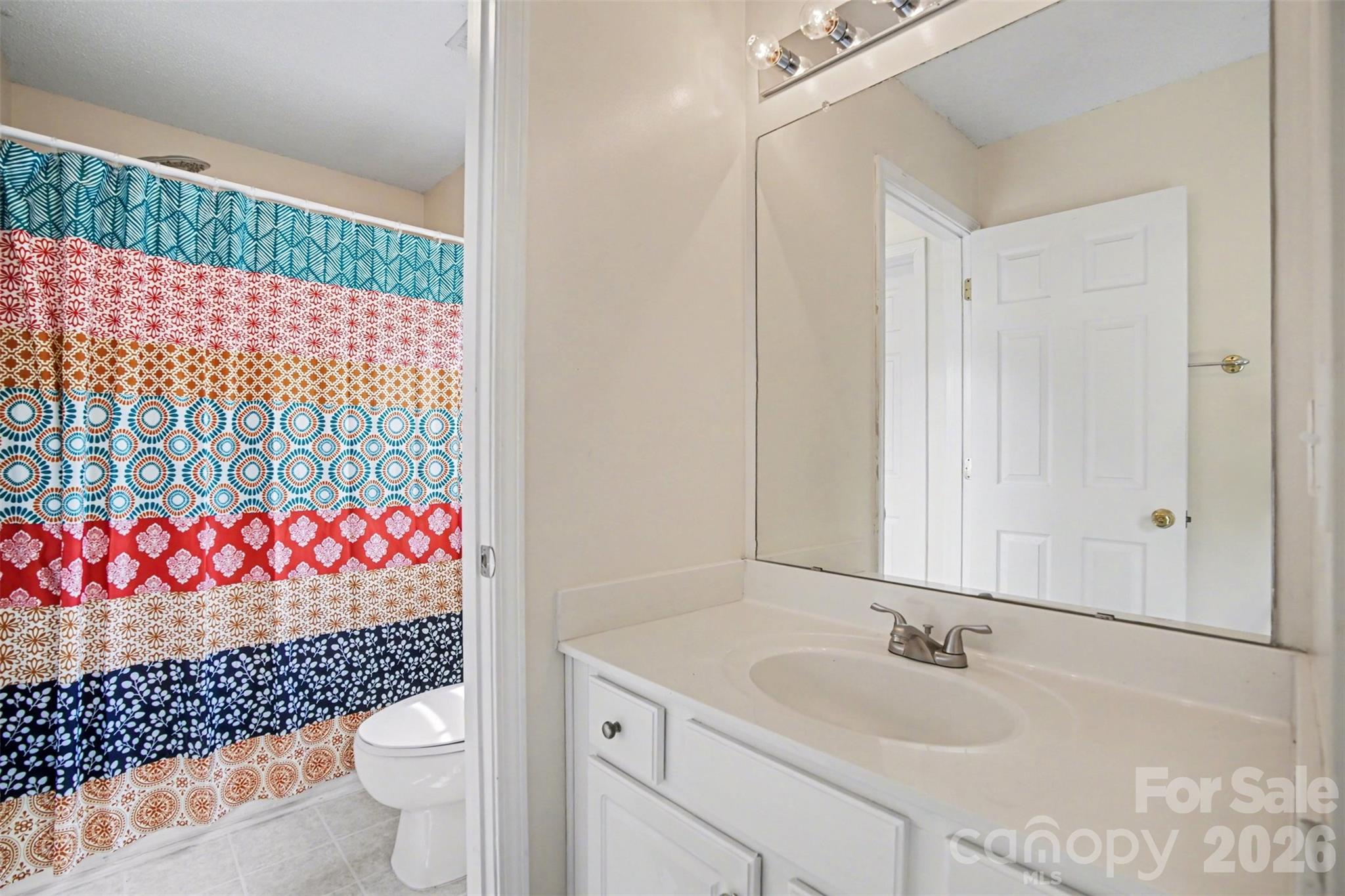3315 Summerfield Ridge Lane Matthews, NC 28105 - Photo 20 of 27 a bathroom with a sink toilet and shower