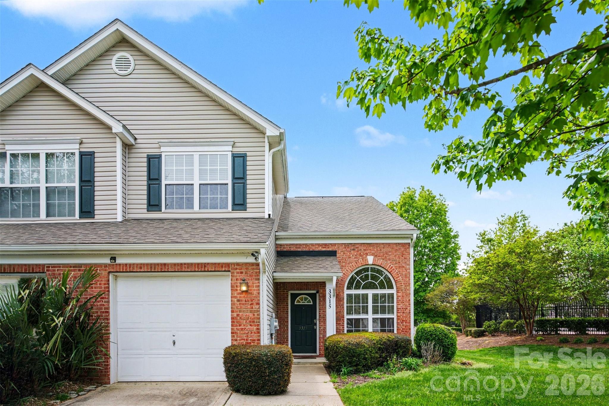 3315 Summerfield Ridge Lane Matthews, NC 28105 - Photo 2 of 27 a front view of a house with garden