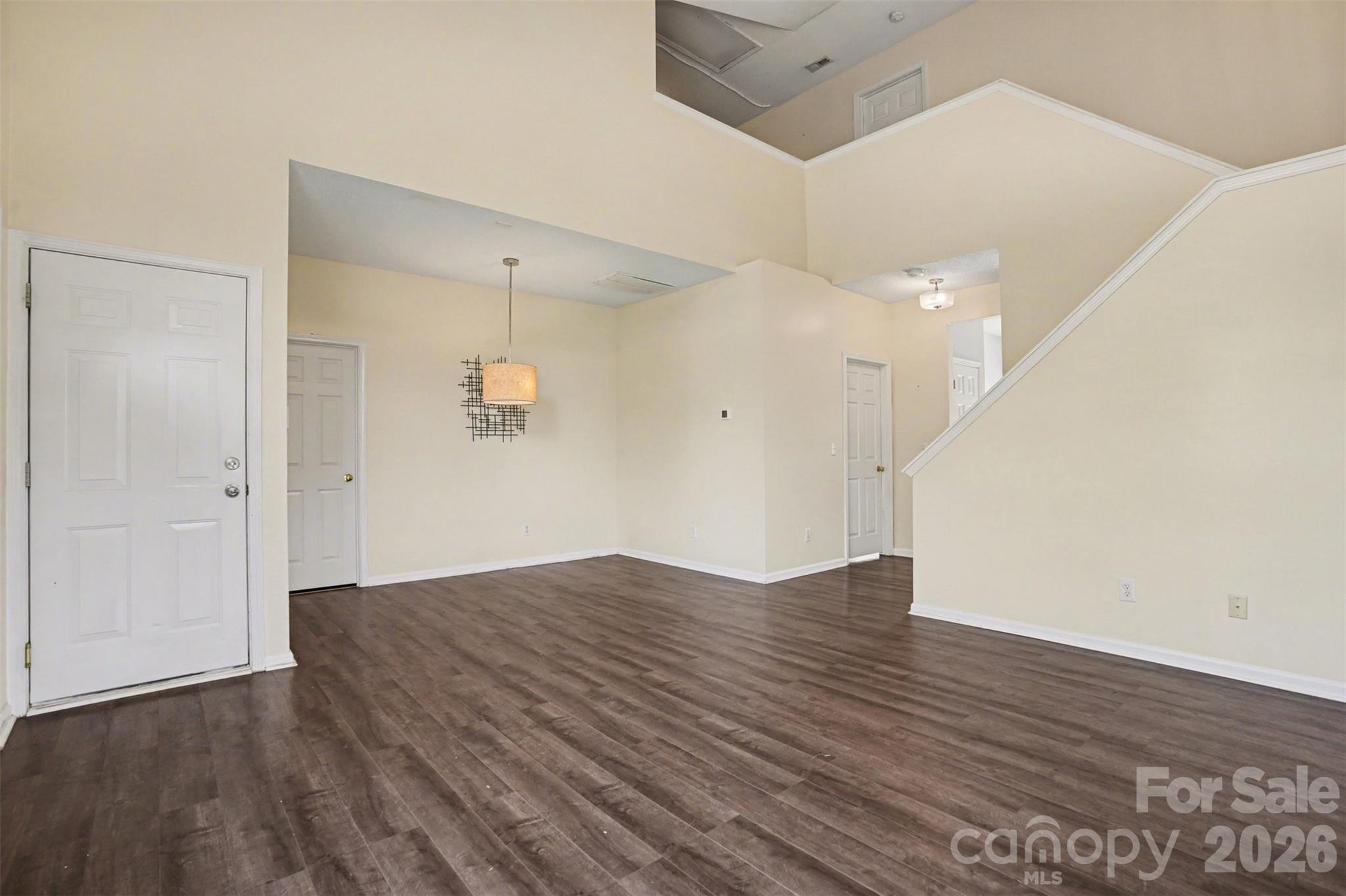 3315 Summerfield Ridge Lane Matthews, NC 28105 - Photo 5 of 27 an empty room with wooden floor and windows