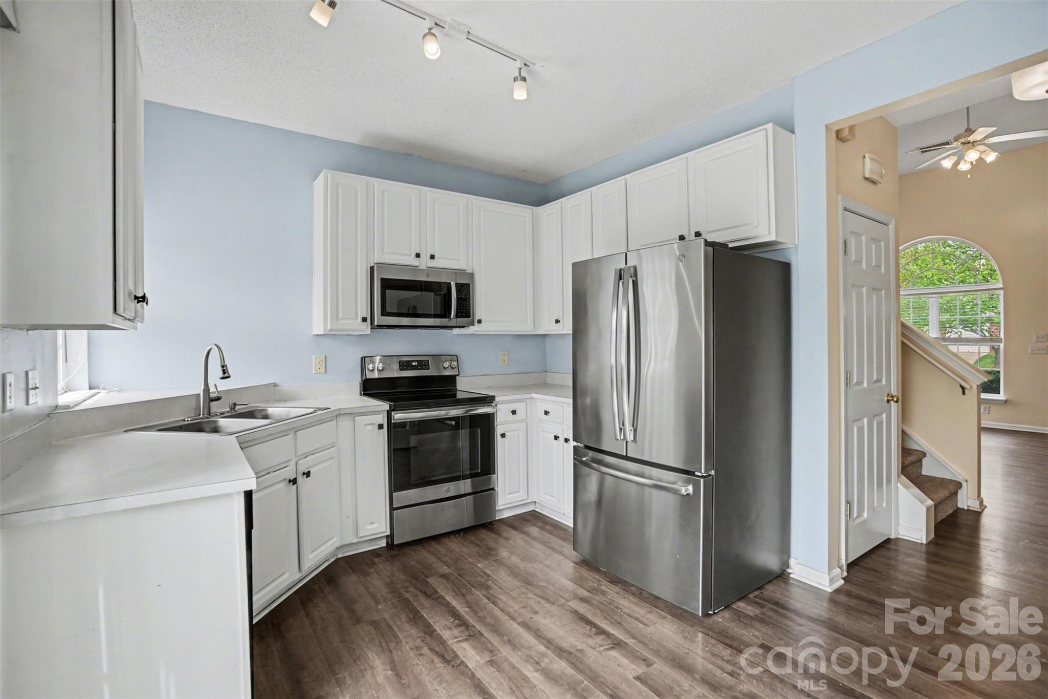 3315 Summerfield Ridge Lane Matthews, NC 28105 - Photo 9 of 27 a kitchen with a refrigerator stove and sink