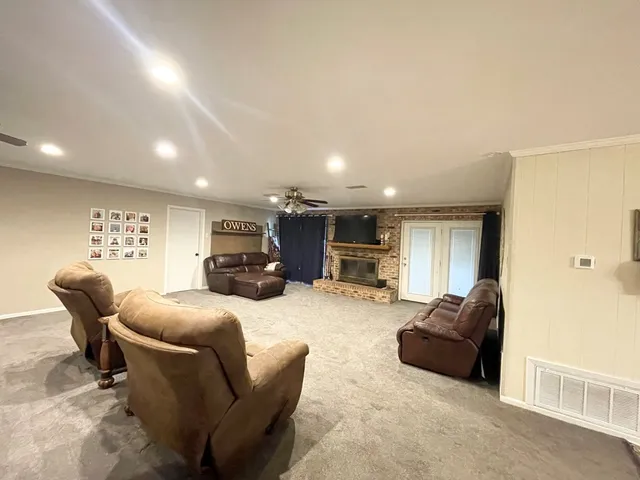 a living room with furniture a couch and dresser