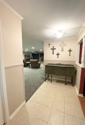a view of kitchen with furniture and refrigerator