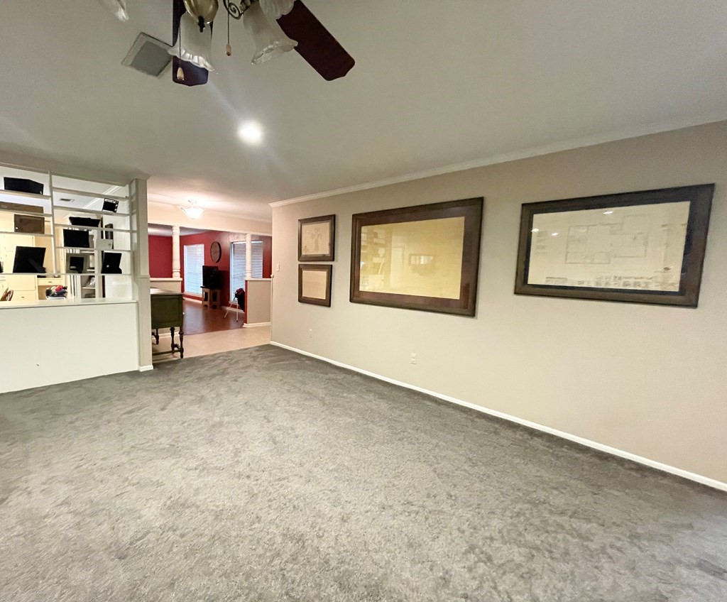 807 El Camino Road Grapeland, TX 75844 - Photo 17 of 34 a view of a livingroom with furniture and a ceiling fan