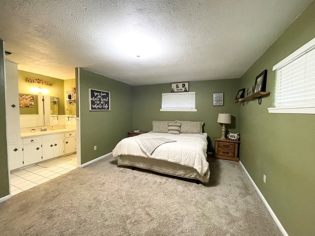 807 El Camino Road Grapeland, TX 75844 - Photo 18 of 34 a bedroom with a bed and a night stand