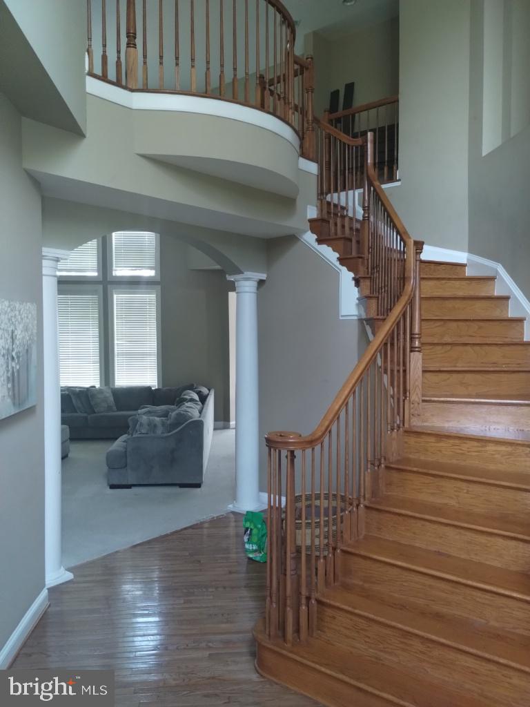 43417 Cedar Place Chantilly, VA 20152 - Photo 7 of 24 Elegant staircase in a welcoming foyer.