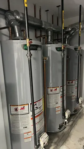 a room with water heater and storage