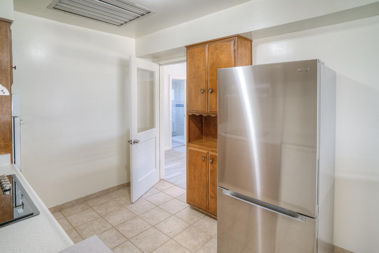 874 South Meridian Road Meridian, CA 95957 - Photo 15 of 54 a refrigerator freezer sitting inside of a kitchen