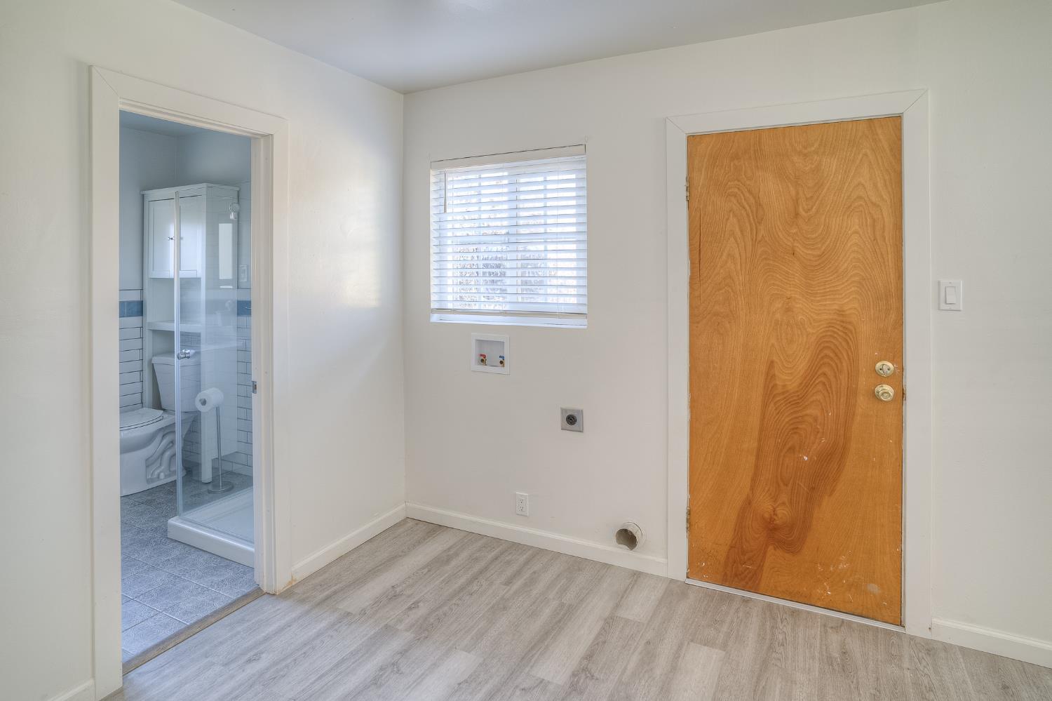 874 South Meridian Road Meridian, CA 95957 - Photo 20 of 54 a view of an empty room with wooden floor and a window