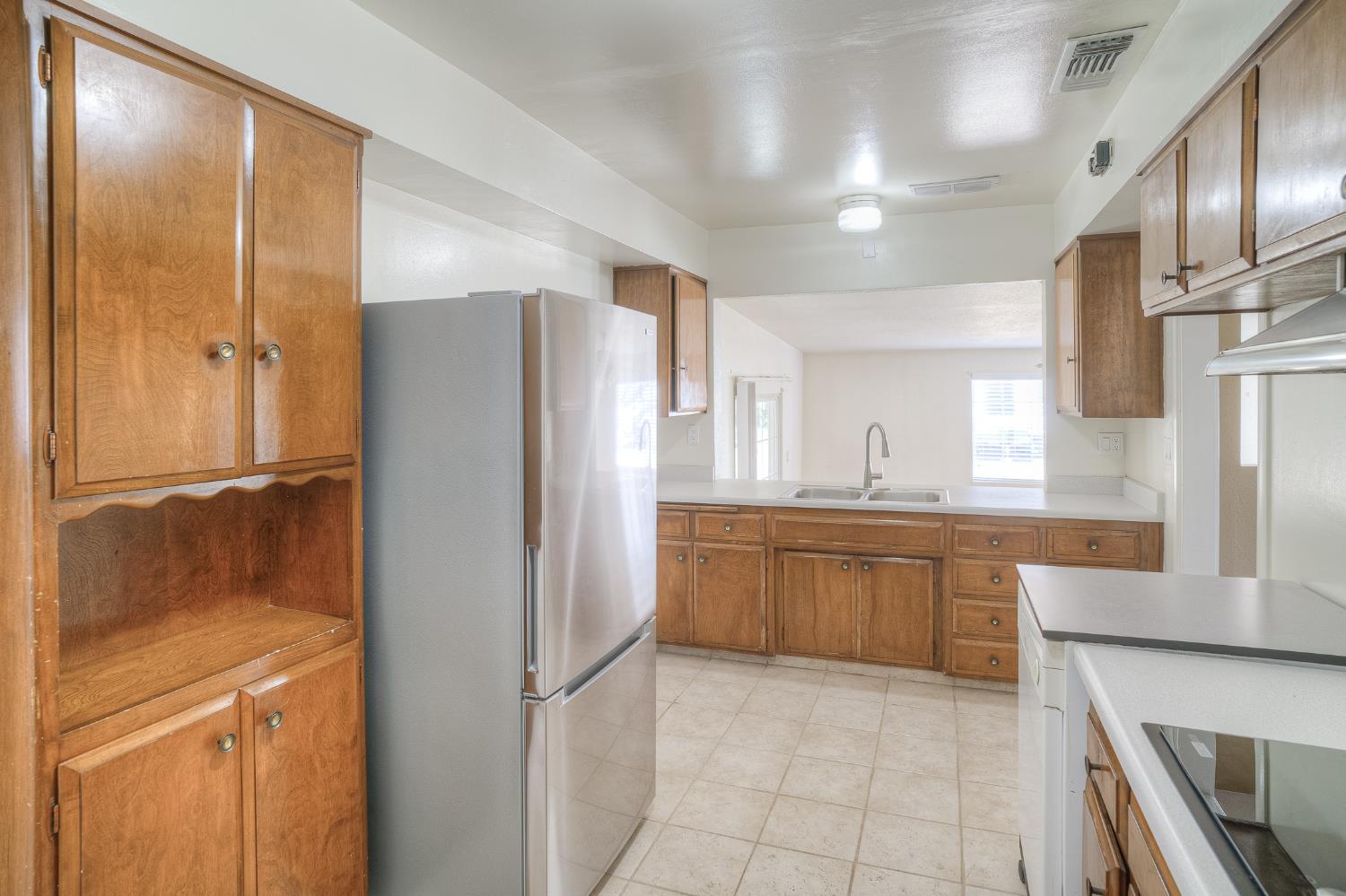 874 South Meridian Road Meridian, CA 95957 - Photo 22 of 54 a kitchen with stainless steel appliances granite countertop a refrigerator and a sink
