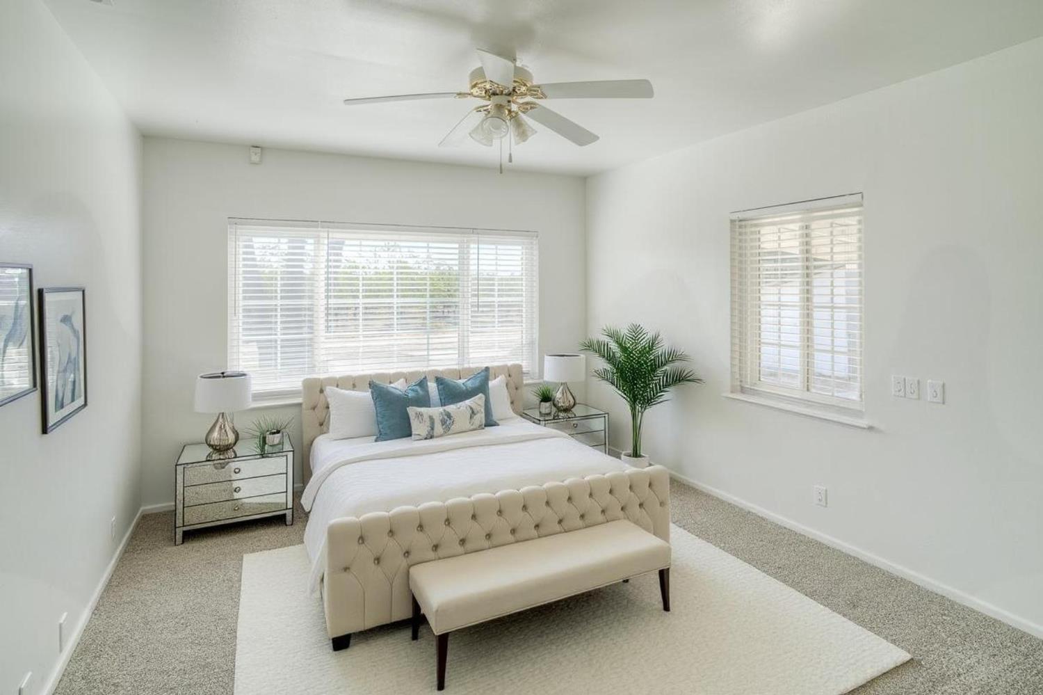874 South Meridian Road Meridian, CA 95957 - Photo 25 of 54 a bedroom with a bed and a chandelier