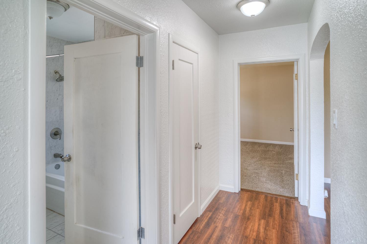 874 South Meridian Road Meridian, CA 95957 - Photo 29 of 54 a view of a hallway with wooden floor