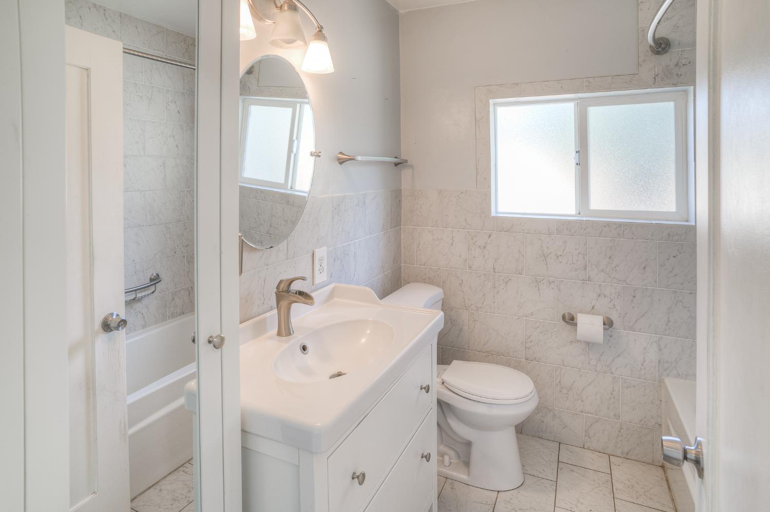 874 South Meridian Road Meridian, CA 95957 - Photo 30 of 54 a bathroom with a toilet sink and mirror