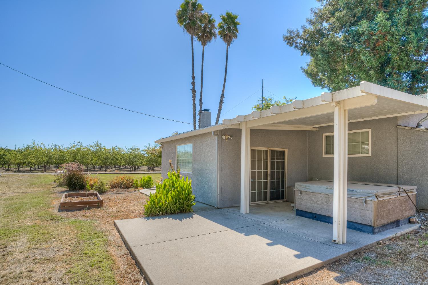 874 South Meridian Road Meridian, CA 95957 - Photo 34 of 54 a view of a patio with couches table and chairs under an umbrella
