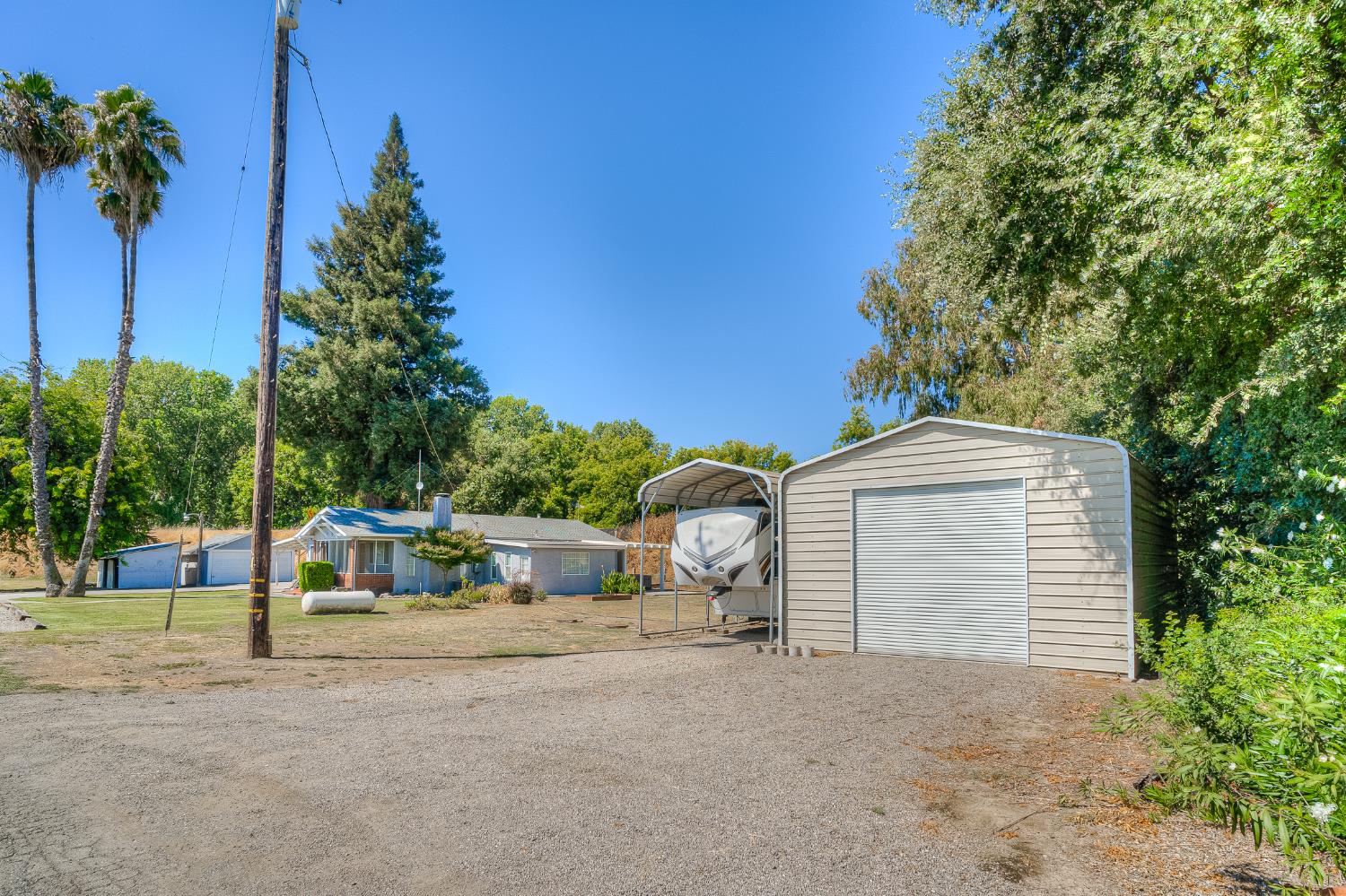 874 South Meridian Road Meridian, CA 95957 - Photo 42 of 54 a view of a house with a backyard and a tree