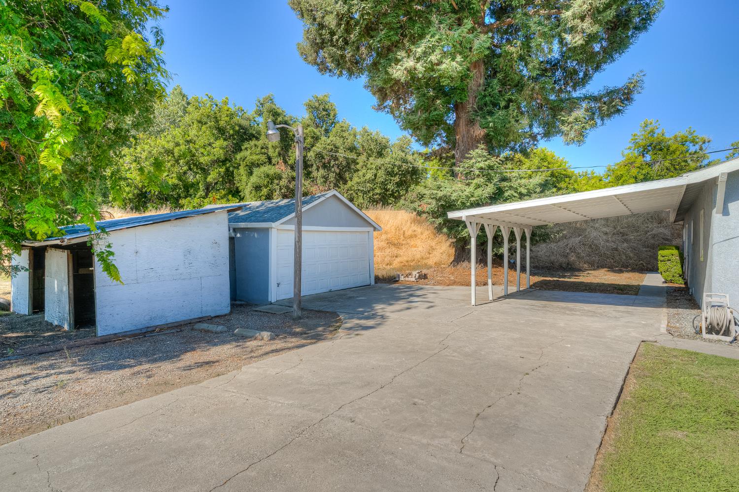 874 South Meridian Road Meridian, CA 95957 - Photo 46 of 54 a view of a house with a yard and a garage