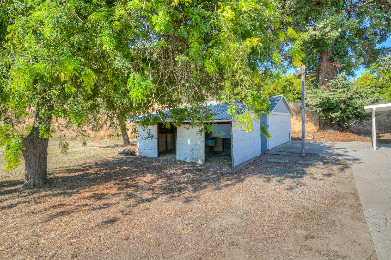 874 South Meridian Road Meridian, CA 95957 - Photo 48 of 54 a front view of a house with a yard and garage