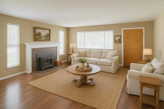 a living room with furniture and a fireplace