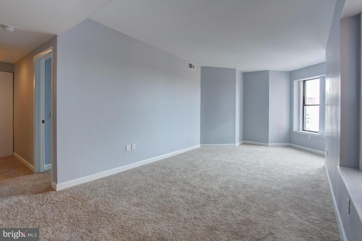 1763 Columbia Road Northwest, Unit 305 Washington, DC 20009 - Photo 12 of 19 Continuing across living room toward the hallway