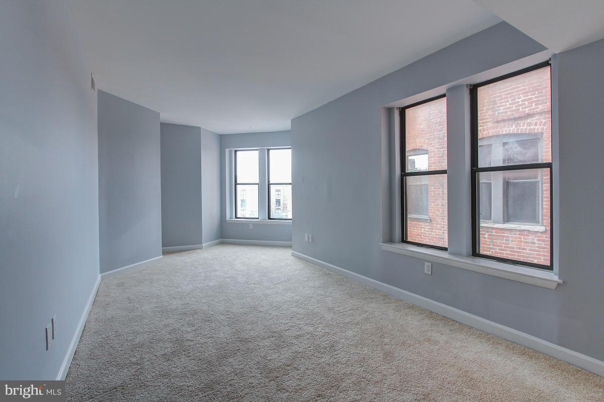 1763 Columbia Road Northwest, Unit 305 Washington, DC 20009 - Photo 4 of 19 Initial view of living room -- lots of windows!