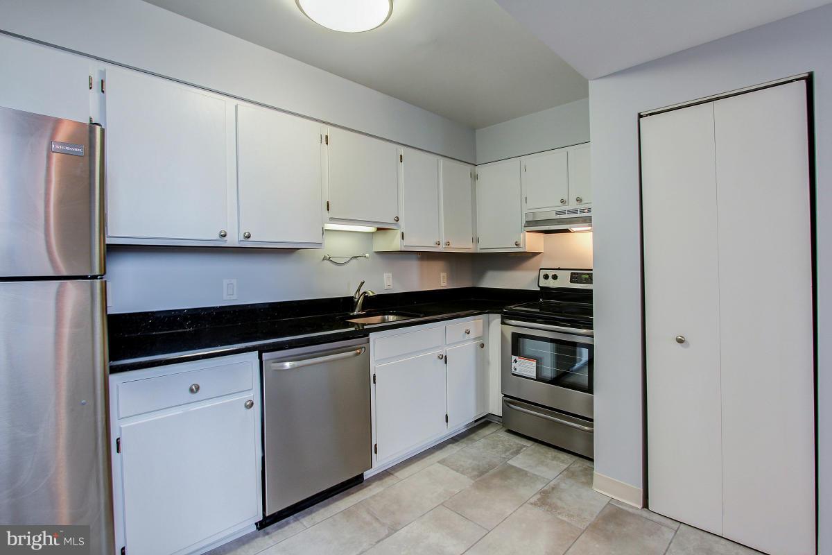 1763 Columbia Road Northwest, Unit 305 Washington, DC 20009 - Photo 7 of 19 Kitchen with new granite counter and SS appliances