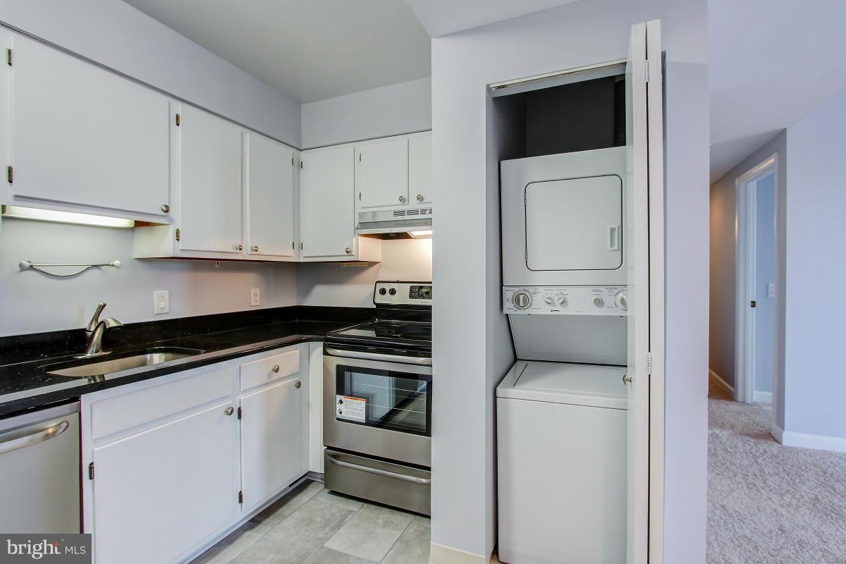 1763 Columbia Road Northwest, Unit 305 Washington, DC 20009 - Photo 8 of 19 And a washer/dryer