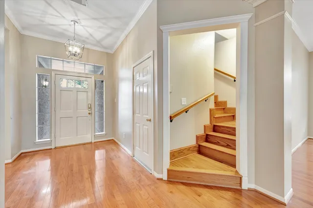 a view of entryway with wooden floor and stair