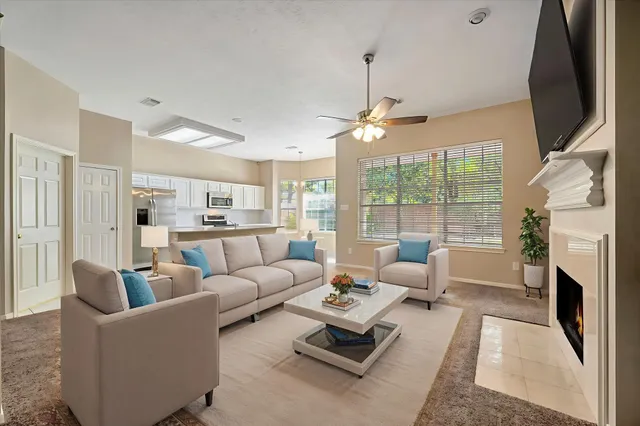 a living room with furniture fireplace and a flat screen tv