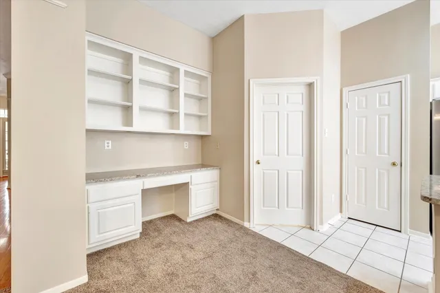 a room with a furniture and cabinets